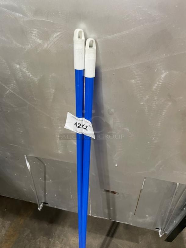 Carlisle Duo-Sweep Series blue industrial broom, model 3686403, new condition, with white handles; bid tag attached.