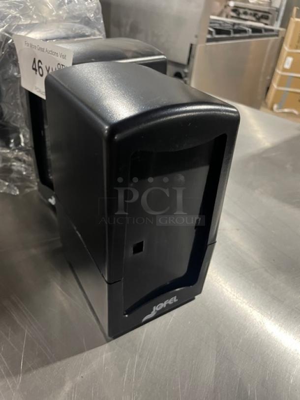 Jofel commercial black tabletop tall-fold napkin dispensers, new condition, logo visible, auction lot number 46.