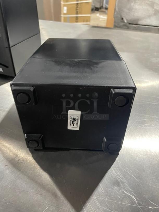 NEW Jofel black tabletop tall-fold napkin dispenser, commercial use, new condition, rubber feet, barcode label visible.