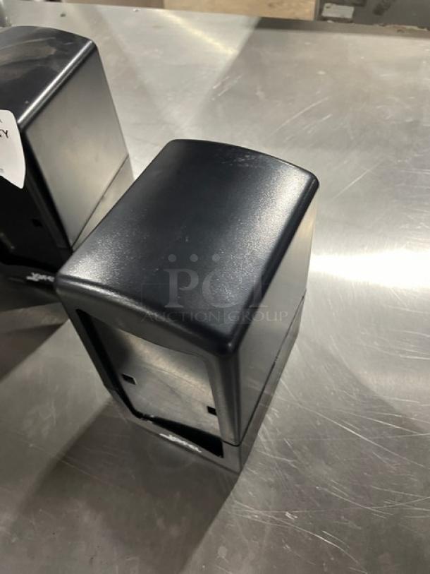 NEW Jofel commercial black tabletop tall-fold napkin dispenser, sleek design, durable plastic, perfect for counter use.