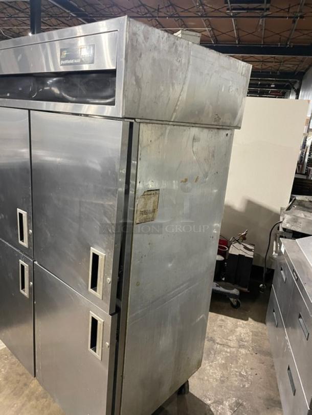 Delfield/Alco stainless steel 4-door refrigerator/freezer combo with poly-coated racks, on casters. Dual-zoned. Used condition.