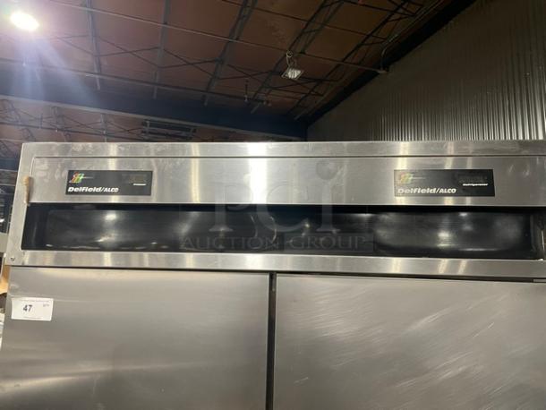 Delfield/Alco stainless steel 4-door refrigerator/freezer combo with poly-coated wire racks on casters, dual-zoned.