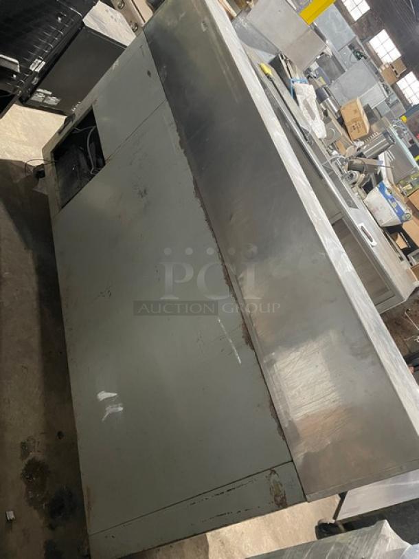 Bari 3-door refrigerated pizza prep table, stainless steel, marble-style worktop, on casters, fair condition.