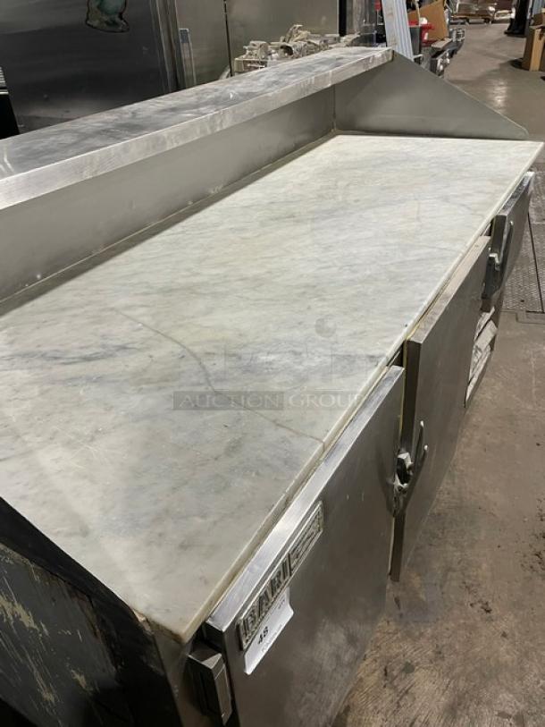 Bari commercial 3-door refrigerated pizza prep table with marble-style worktop, stainless steel, on casters.