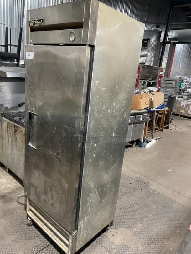 True Commercial Stainless Steel Single Door Reach-In Freezer, Model T-19FZ. Features poly-coated wire racks, 115V, 1 Phase, on casters.