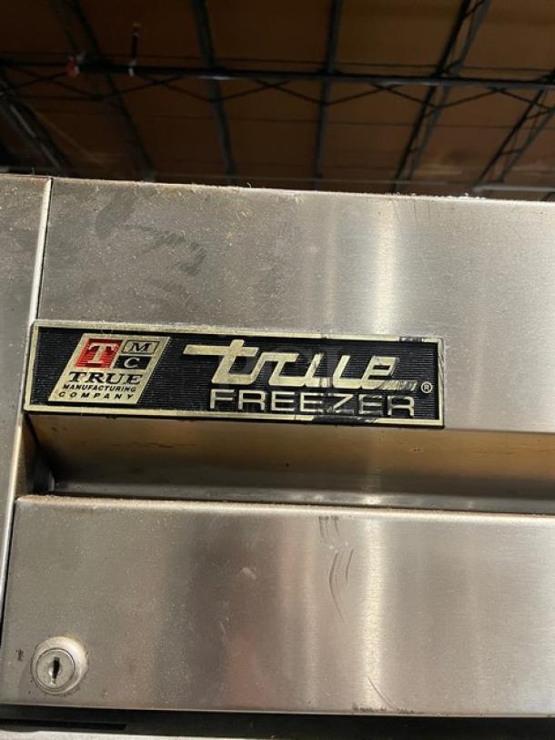 True Commercial Stainless Steel Single Door Reach-In Freezer, Model T-19FZ, with poly-coated wire racks and casters.