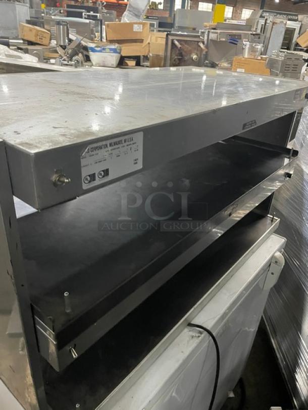 Hatco Glo-Ray GRSDH41D electric double-tier heated display case, gray granite finish, used condition, model tag visible.