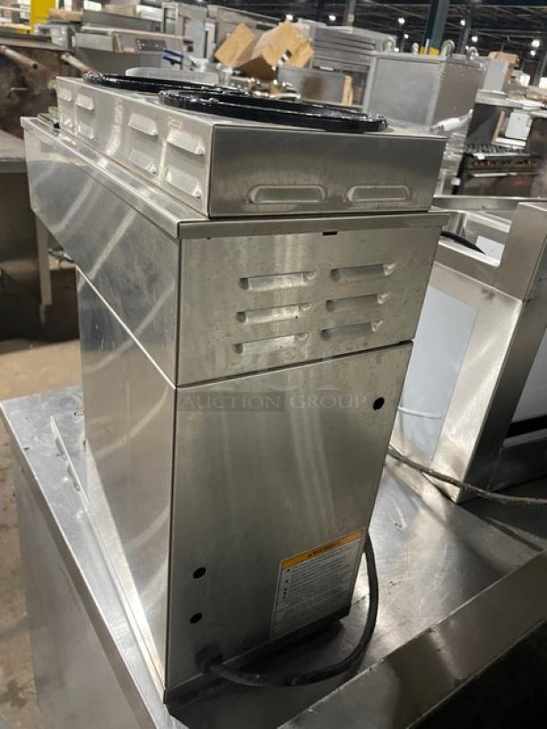Bunn VP173 Commercial Stainless Steel Coffee Brewer, electric-powered, with 3 warmers. Visible SN: VP17256079. Good condition.