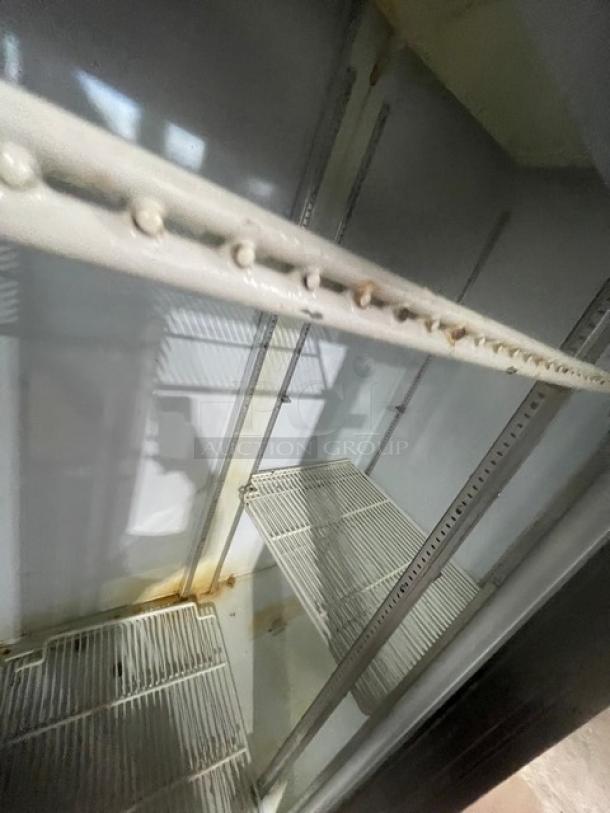 Beverage-Air MT38B commercial black double glass sliding door refrigerator, with poly coated wire racks, visible signs of wear.
