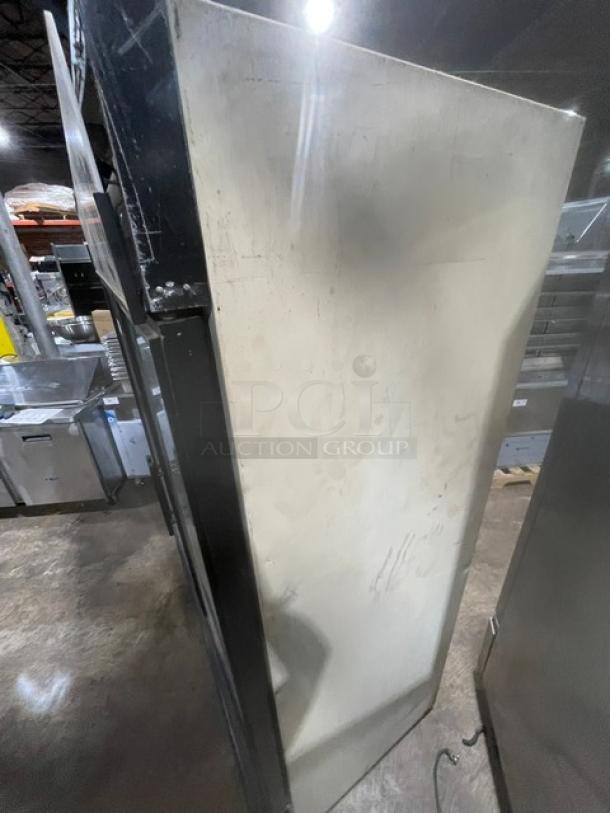 True Commercial Double Glass Door Refrigerator, Model GDM-49, includes poly-coated wire racks. 115V, 1 Phase, SN: 1-2601155. Signs of wear.