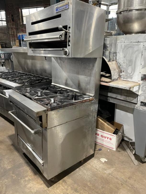U.S. Range stainless steel 6-burner gas range/oven combo with overhead salamander broiler, wired racks, on legs.