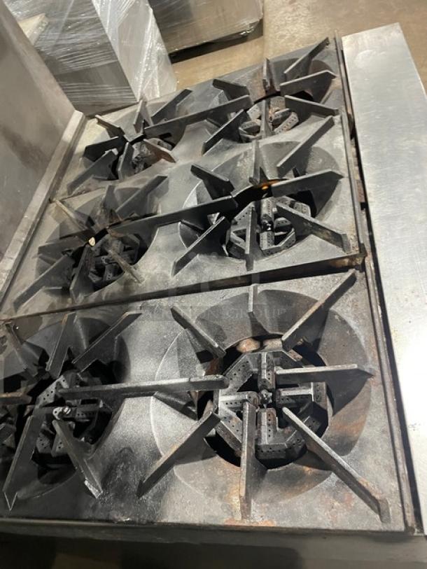 U.S. Range commercial stainless steel 6-burner range/oven combo with overhead salamander broiler, on legs, used condition.
