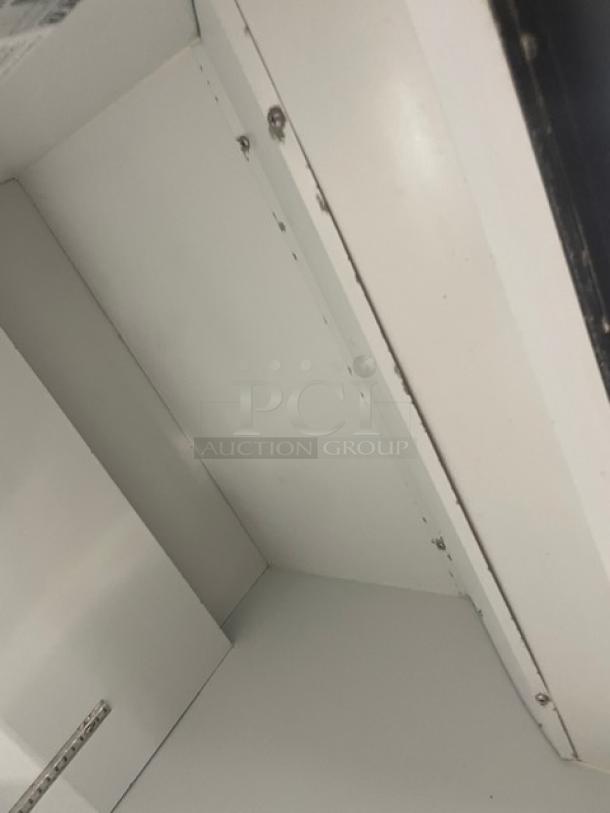 Habco ESM28 commercial refrigerator interior, showing white shelving and clean surfaces. Energy Star Certified, single glass door model.