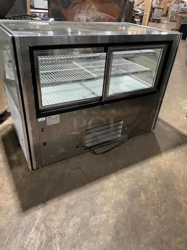 Leader CBK57SC 57" stainless steel refrigerated bakery display case, straight glass, adjustable wire racks, 115V, 1 phase.