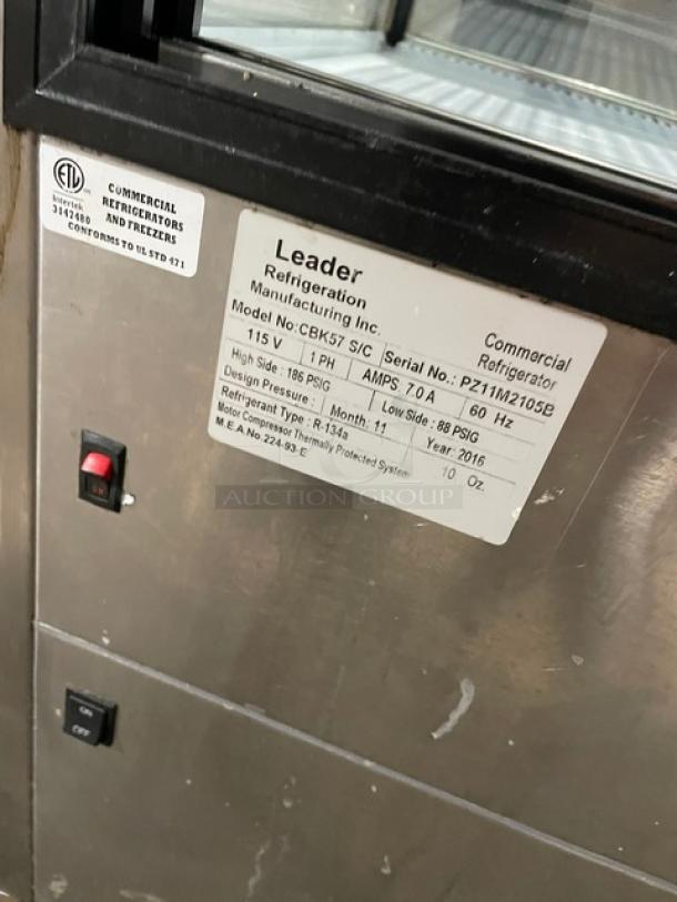 Leader Commercial Stainless Steel Straight Glass 57" Bakery Display Case, Model CBK57SC, 115V 1 Phase. Features poly coated wire racks, serial number PT11M2105B. Ideal for displaying refrigerated bakery items.