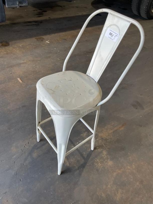 Distressed white bistro-style bar-height stool; metal construction, indoor/outdoor use, marked for auction.