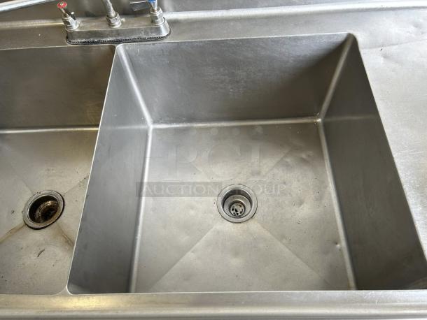 All stainless steel 3 compartment sink in excellent condition, fully tested, showing faucet and drain details.