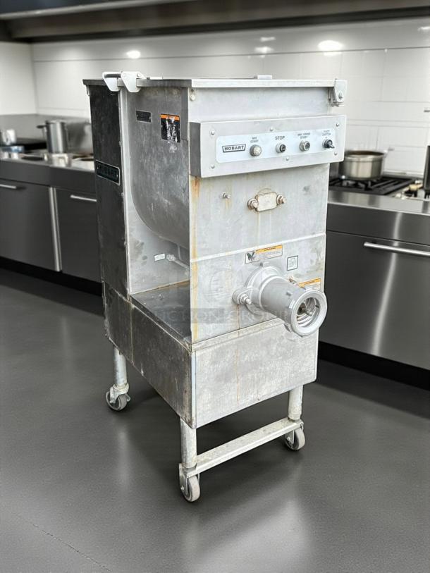 Hobart 4246-2 #32 meat grinder/mixer, 7.5 hp, fully tested, functioning, stainless steel, control panel with labeled buttons.