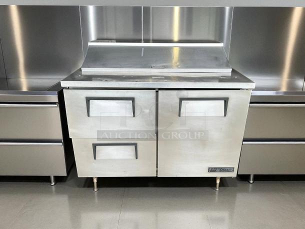 True TSSU-48-12D-2 refrigerated sandwich prep table in excellent condition, with right door, two drawers, fully tested.