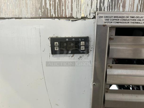 Cooltech CMPH-60HB pastry display case control panel; digital temperature display and vent with operational instructions.