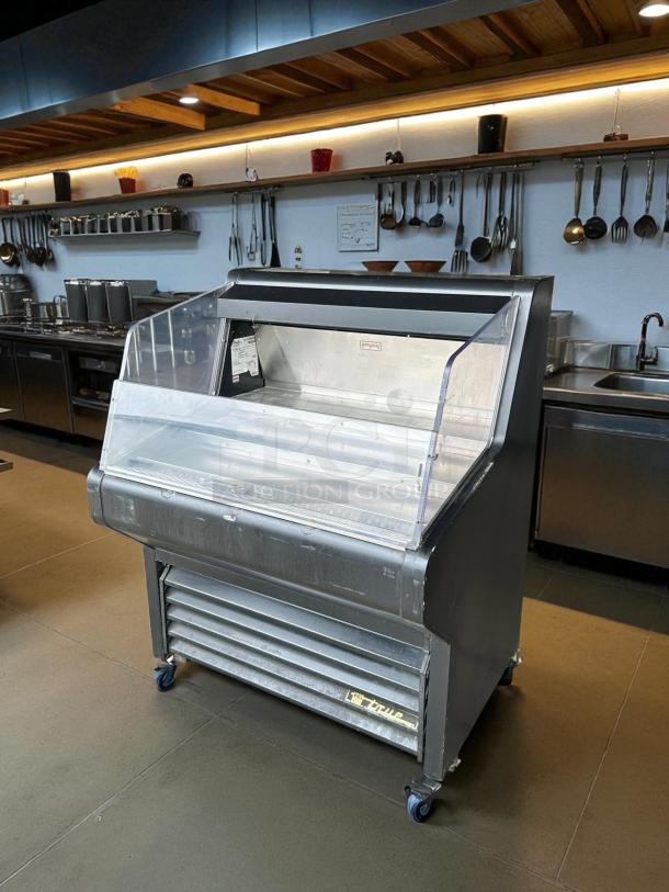 True THAC-36 Black Horizontal Refrigerated Air Curtain Merchandiser, 36 1/8", great condition, fully tested, on wheels.