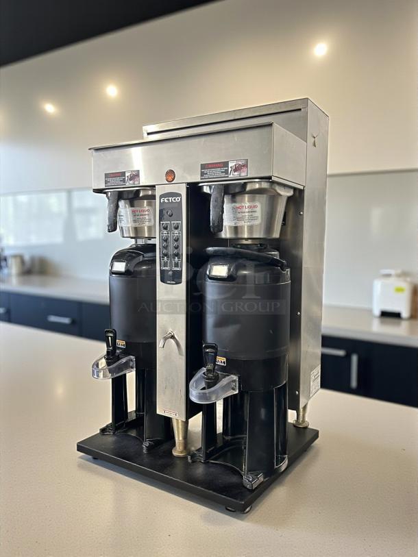 Fetco CBS-2052e dual station coffee brewer in excellent condition, 208-240V, fully tested and working, stainless steel finish.