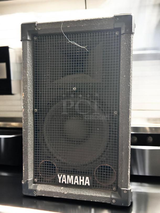 Yamaha 15" 2-way passive loudspeaker, professional PA, well-maintained, tested and working, visible Yamaha logo.