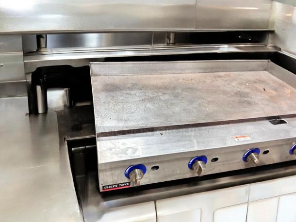 Globe GG48TG 48" countertop gas griddle, used, with blue knobs and visible controls, tested and in working condition.