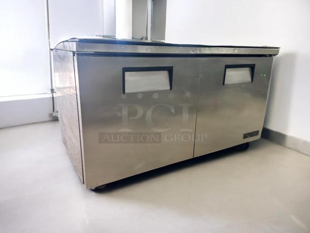 True TWT-60F 60" stainless steel two-door worktop freezer with backsplash, 115V, tested and working condition.