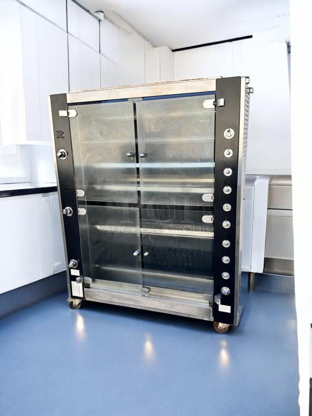 Rotisol RR-20 rotisserie oven, 20 spit capacity, natural gas, outstanding condition, fully tested, sleek black and silver design.