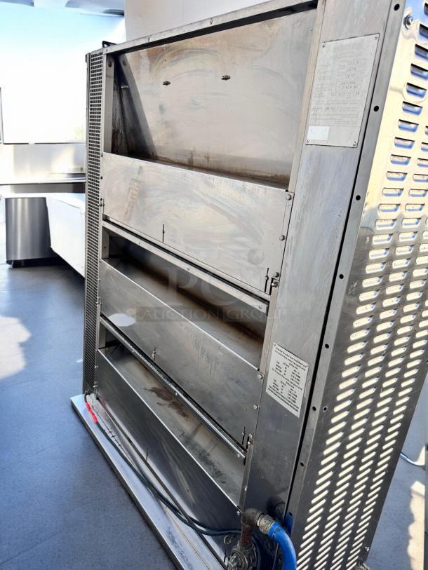 Rotisol RR-20 rotisserie oven, 20 spit capacity, natural gas, outstanding condition, visible control panel, sturdy build.