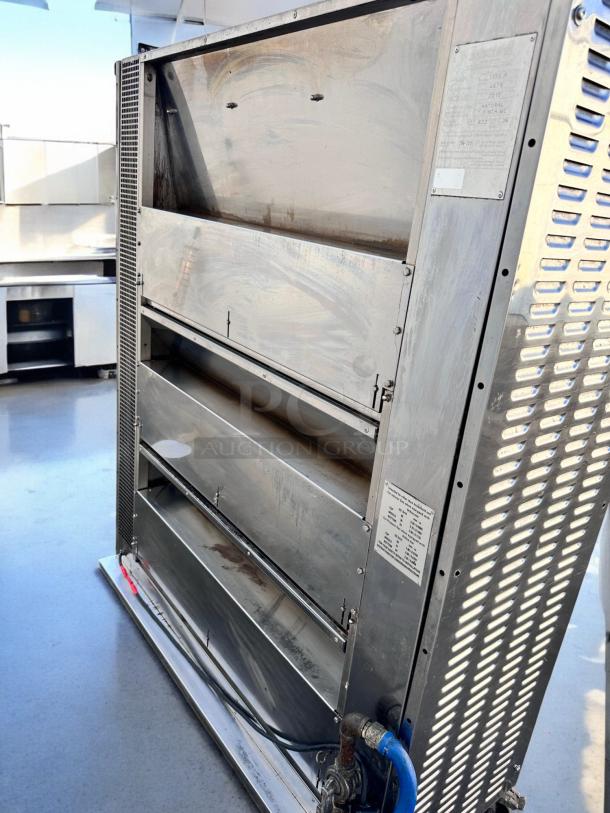 Rotisol RR-20 rotisserie oven, 20 spit capacity, natural gas, excellent condition, stainless steel, fully tested, with visible labels.