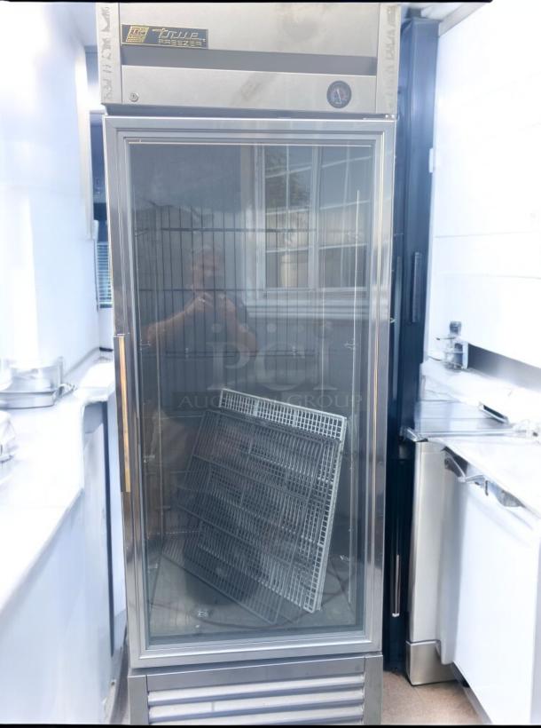 True GDM-23F-HC~TSL01 single glass door freezer, stainless steel, 115V, fully tested, excellent condition, visible shelves.