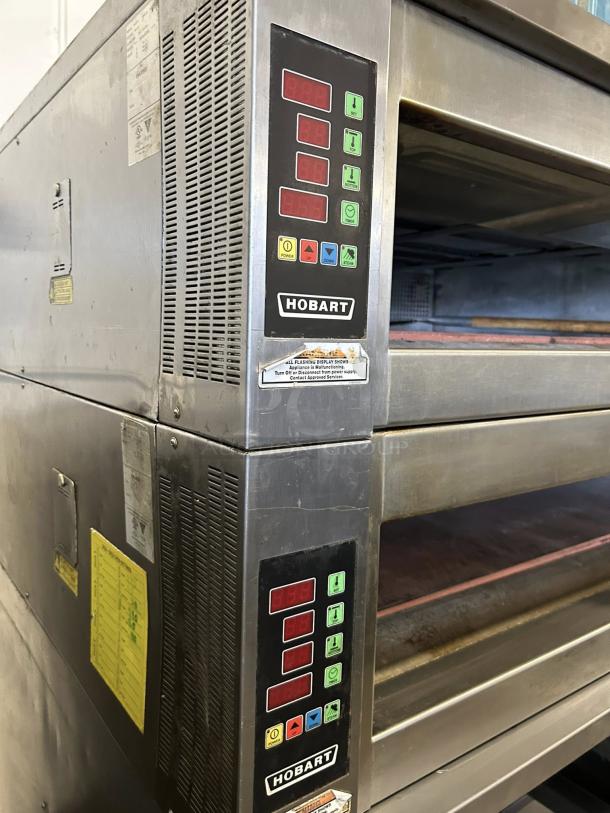 Hobart HWD03D-4 double deck electric deck oven with stand, shown in outstanding condition, featuring digital controls and visible branding.