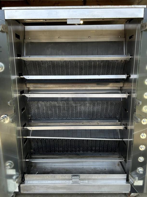 Rotisol USA FB1400-8G-SS gas rotisserie with 8 spits, 48 bird capacity, excellent condition, natural gas, tested and working.