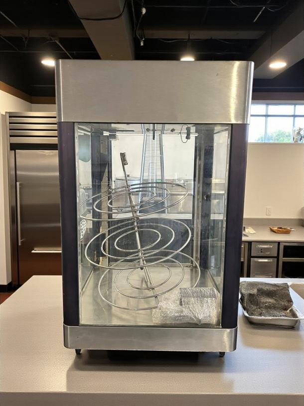 Star HFD-2A heated display cabinet with rotating racks, stainless steel, excellent condition, 120V, tested and working.