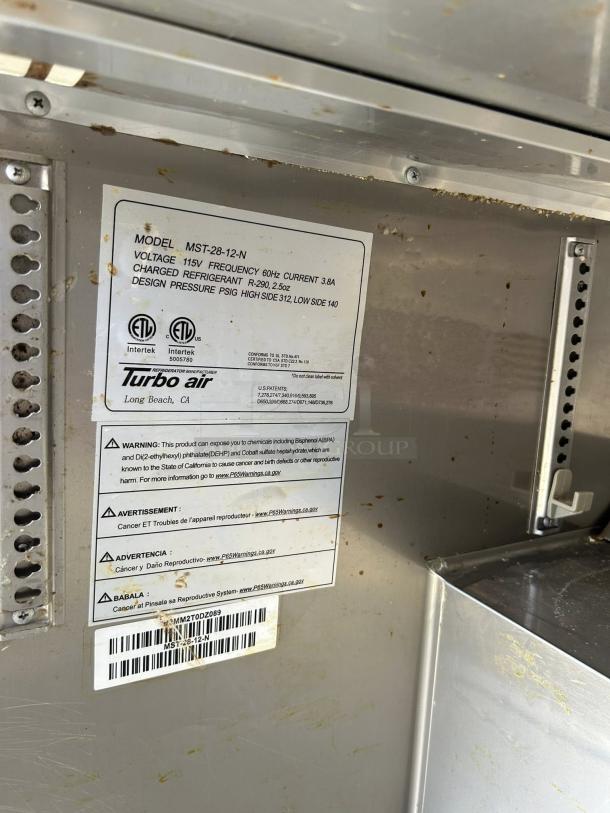 Turbo Air MST-28-N stainless steel refrigerated sandwich prep table, model and safety labels visible, great condition.