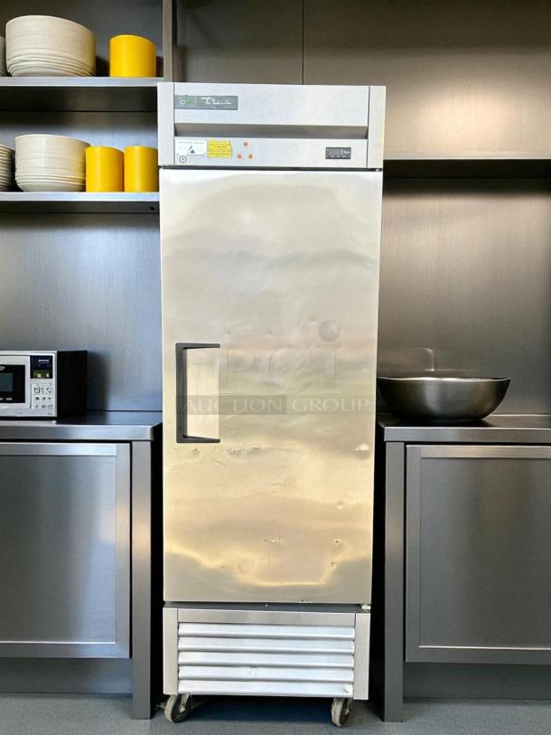 True T-23F-HC single door reach-in freezer, 115V. Stainless steel, tested working, no visible damage, on wheels.