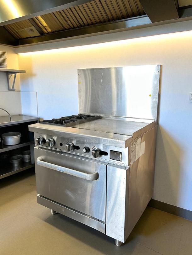 ATOSA AGR-2B24GR gas range with oven, 36" width, 2 burners, 24" griddle on right. Stainless steel, excellent condition.