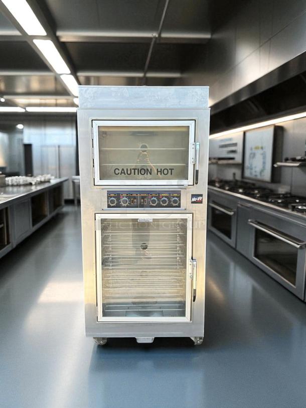 NuVU model SUB-123P double deck electric oven proofer combo, stainless steel, labeled "Caution Hot." Excellent condition.