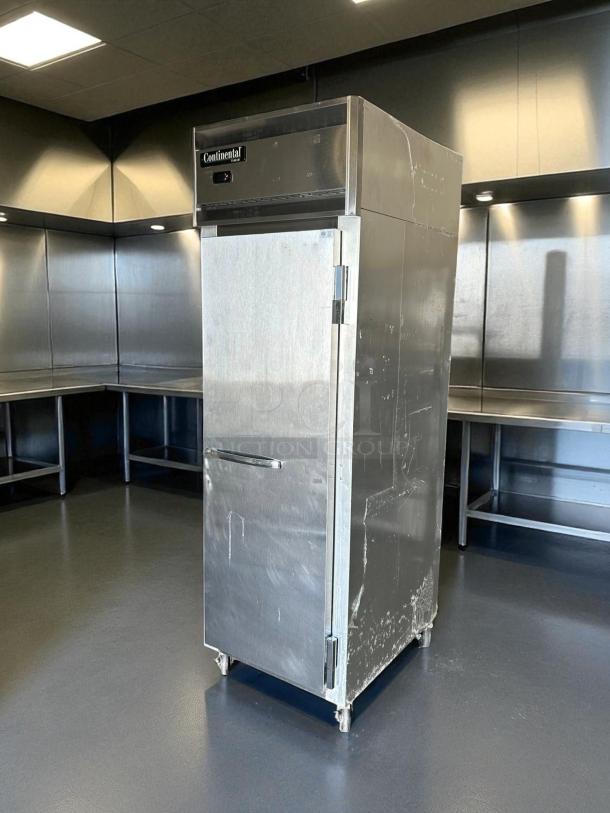 Continental 1FN 26" reach-in freezer, right-hinged solid door, stainless steel, tested and working, 115V, visible wear.