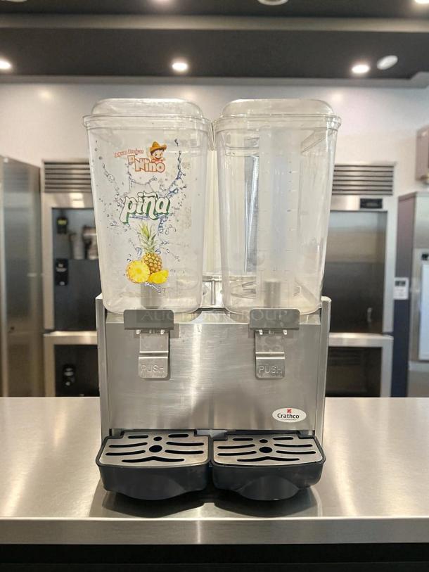Crathco D25-4 beverage dispenser, double 5-gallon bowls, high-impact plastic, stainless steel base, fully tested, great condition.