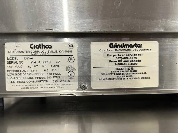 Crathco D25-4 beverage dispenser label showing model details, serial number, and safety warnings. Made in USA.