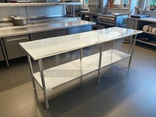 Uline H-10348 stainless steel worktable, like new, 96x30", adjustable height, bottom shelf, kitchen setting.