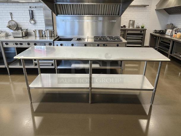 Uline H-10348 stainless steel worktable, like new, 96x30 inches, adjustable height, with bottom shelf, ideal for kitchens.