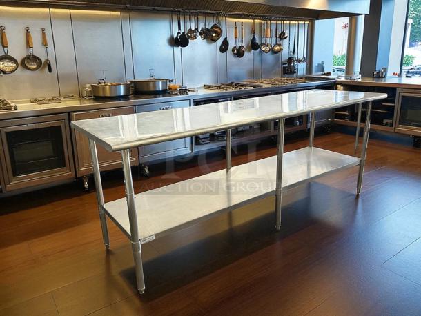 Uline H-10348 stainless steel worktable, like new, 96"x30", adjustable height, with bottom shelf, sleek kitchen setting.