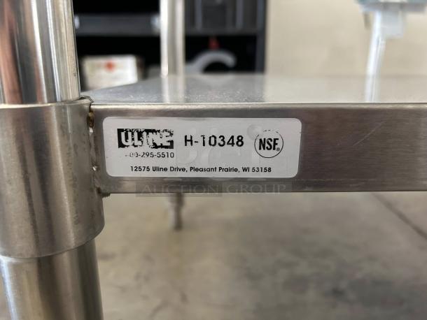 Uline H-10348 stainless steel worktable, 96x30", adjustable height, like new, with bottom shelf. NSF certified tag shown.