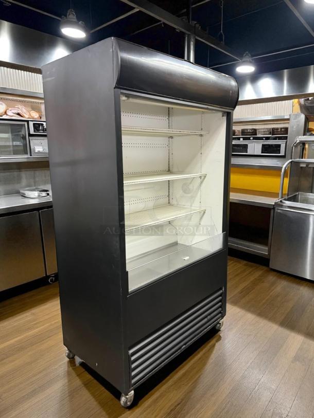 True TAC-48 air curtain merchandiser, excellent condition, 208/230V, fully tested, black exterior, adjustable shelves.