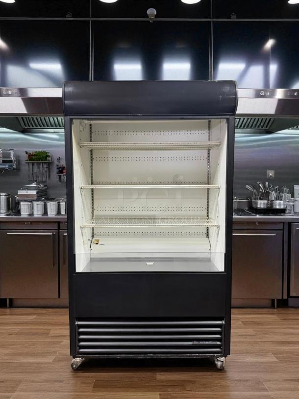 True TAC-48 Air Curtain Merchandiser in excellent condition, 208/230V, fully tested and working, with shelving and casters.