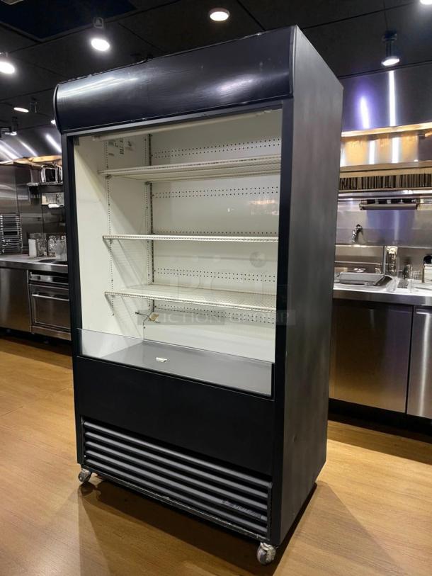 True TAC-48 air curtain merchandiser in excellent condition, features multiple shelves, 208/230V, fully tested and working.